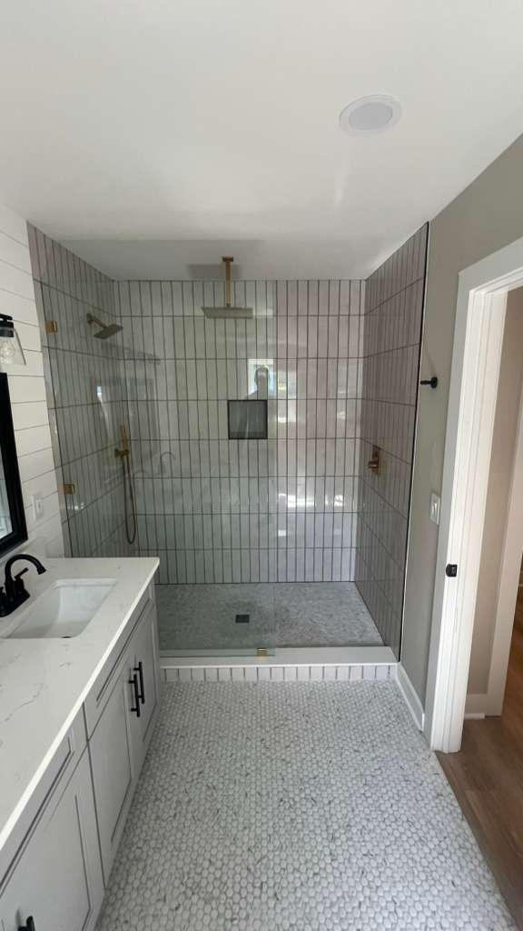 Master bath remodel with walk-in shower, gold rain-head, marble hex floor and white quartz double vanity — Mt Pleasant SC